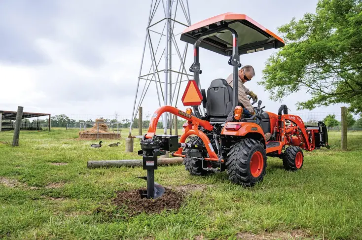 Man using rear drill attachment to make a hole