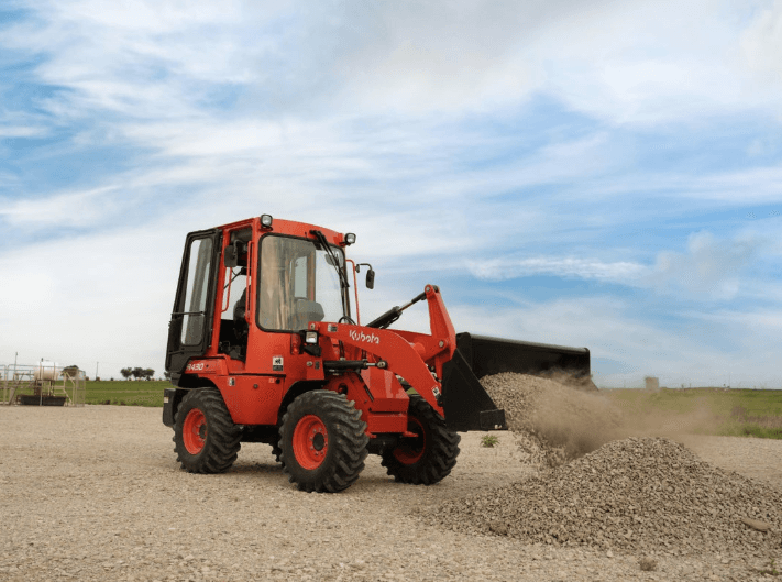 Wheel Loader dumping a bucket full of gravel 