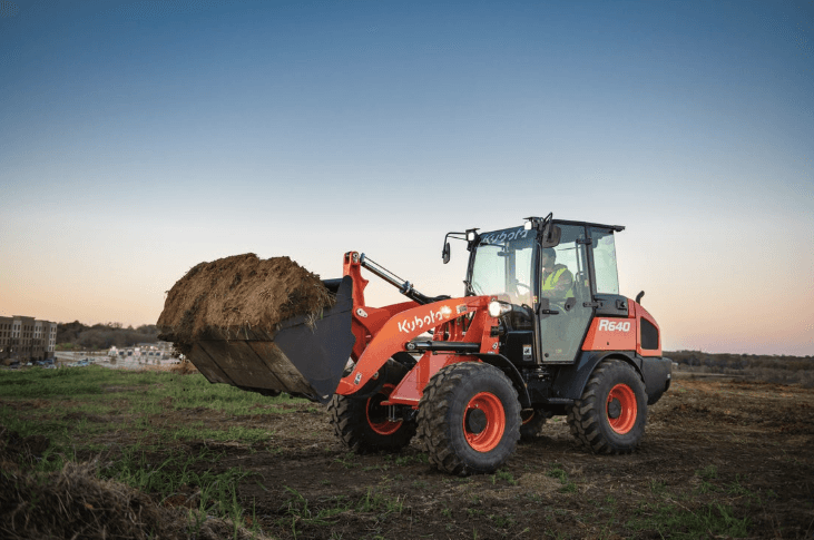 Wheel Loader moving a bucket of dirt