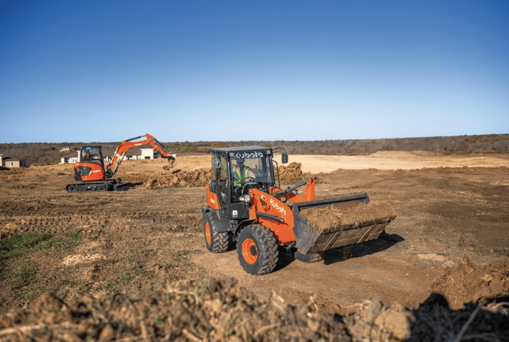 Wheel Loader moving a bucket of dirt on a construction site