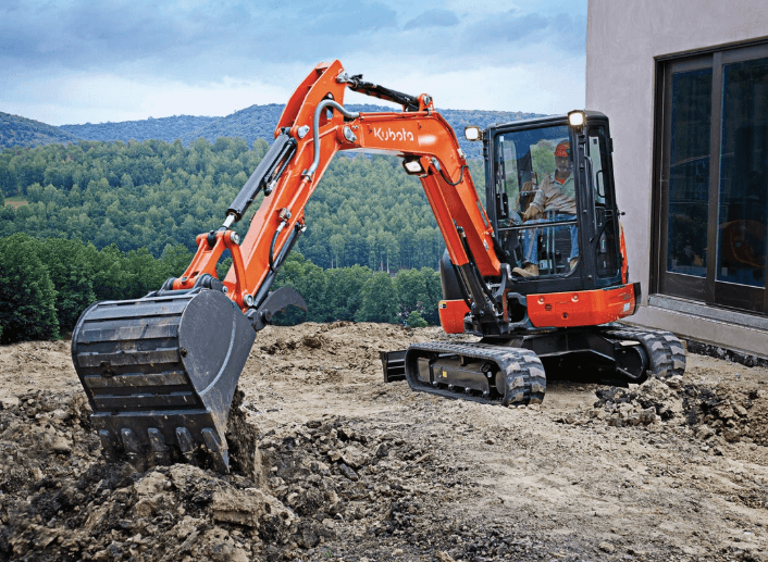 Compact Excavator digging on a construction site