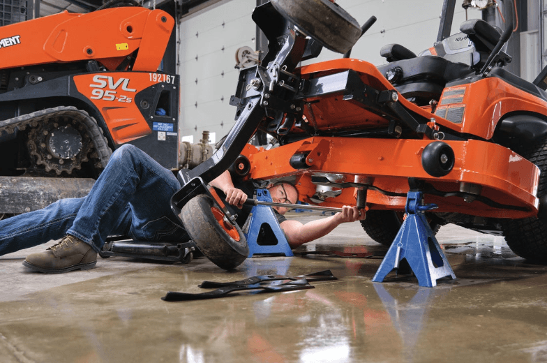 Service Technician working on a mower
