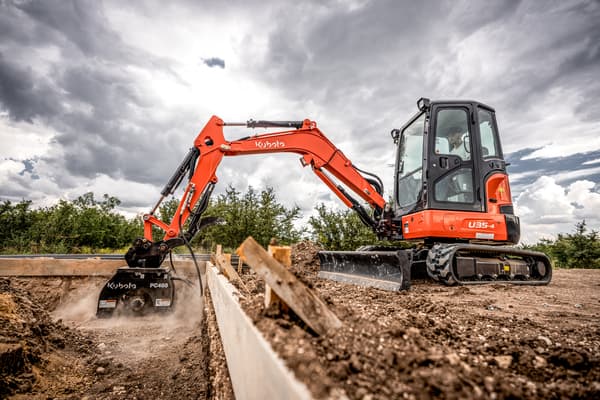 Kubota U35-4 compact excavator breaking ground