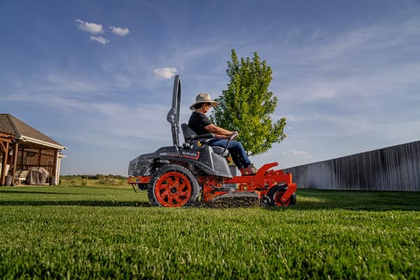 Man mowing with Kubota zero turn